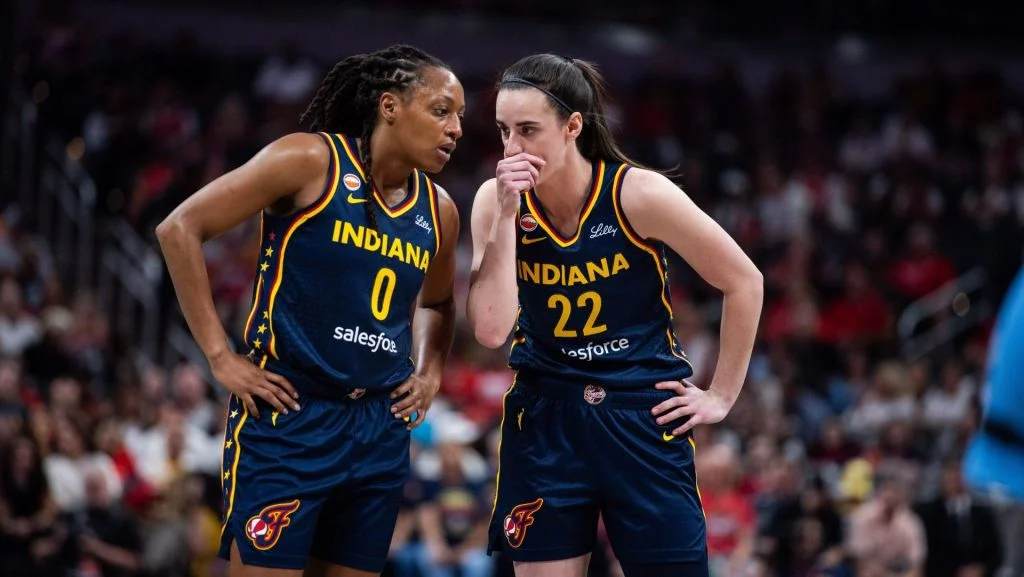 Caitlin Clark Presses for Kelsey Mitchell’s Return Amidst Controversial Fan Backlash